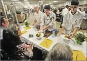  ?? Dan Watson/ The Signal ?? Cooking contest teammates from left, Skyler Sheridan, Kyla Newland and Kyle Weber, present their fish and chips dish to the judges at Culinary Arts Pathway throwdown event held at West Ranch High School.