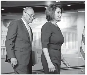  ?? AP/J. SCOTT APPLEWHITE ?? Senate Minority Leader Charles Schumer and House Speaker Nancy Pelosi arrive for a news conference Wednesday after their short meeting with President Donald Trump. They both expressed disappoint­ment. “To watch what happened in the White House would make your jaw drop,” Schumer said. Pelosi said she was praying for the president “and I pray for the United States of America.”