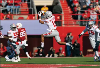  ?? (AP PHOTO/REBECCA S. GRATZ) ?? In a conference known for stodgy offenses and hard-hitting defenses, Big Ten receivers are putting up some gaudy numbers. Ohio State’s Jaxon Smith-Njigba set a school record with 15 catches and nearly set another with 240 yards receiving in a win at Nebraska. He wasn't the only Big Ten receiver with more than 200 yards. Jahan Dotson set a Penn State record with 242. Purdue’s David Bell had 217 while setting a school record with 15 games in triple digits. The Big Ten hasn't had three players with 200 or more yards receiving on the same day since at least 2000.