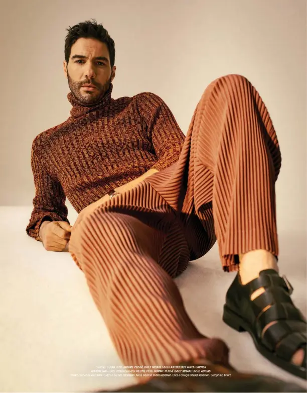  ??  ?? Sweater GUCCI Pants HOMME PLISSÉ ISSEY MIYAKE Shoes ANTHOLOGY Watch CARTIER OPPOSITE PAGE—COAT PRADA Sweater CELINE Pants HOMME PLISSÉ ISSEY MIYAKE Shoes ADIDAS STYLIST: Simonez Wolf HAIR: Ludovic Bordas GROOMING: Anne Bochon PHOTO ASSISTANT: Enzo Farrugia STYLIST ASSISTANT: Seraphine Bitard