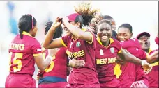  ??  ?? West Indies’ captain Stafanie Taylor (center), celebrates with teammates after victory in the World T20 cricket tournament women’s final match between Australia and West Indies at the Eden Gardens Cricket Stadium in Kolkata on April 3.