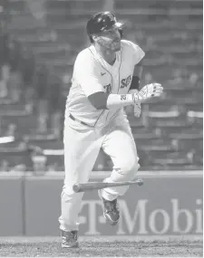  ?? MICHAEL DWYER/AP ?? The Red Sox’s J.D. Martinez watches his two-run double during the 12th inning against the Rays opn Tuesday in Boston.