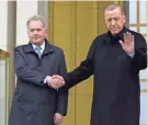  ?? BURHAN OZBILICI/AP ?? Finland’s President Sauli Niinisto, left, is welcomed to the presidenti­al palace in Ankara by Turkish President Recep Tayyip Erdogan on Friday.