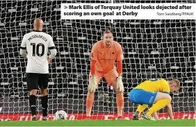  ?? Tom Sandberg/PPAUK ?? > Mark Ellis of Torquay United looks dejected after scoring an own goal at Derby