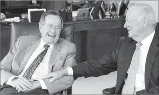  ?? AP PHOTO ?? Former President George H.W. Bush, left, and former Secretary of State James A. Baker III share a moment Jan. 18, 2011, as they talk about the Gulf War and liberation of Kuwait, during an interview in Houston.