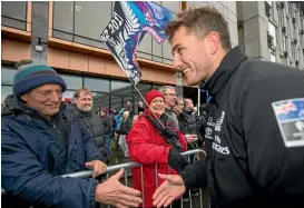  ?? PHOTO: JOSEPH JOHNSON/STUFF ?? Blair Tuke talks with a fan during Team New Zealand’s victory parade in Christchur­ch this week.