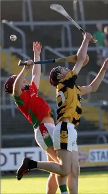  ??  ?? Dillon Redmond (Rapparees) battling with Rathnure’s Cathal O’Connor on a very good evening for the Enniscorth­y club in Innovate Wexford Park on Sunday.