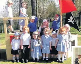  ??  ?? All aboard Fernhill School nursery have thanked the PTA for providing them with a pirate ship for their outdoor playground (above)