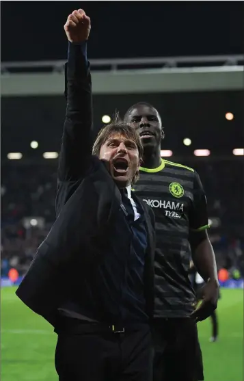  ??  ?? Manager Antonio Conte celebrates after Chelsea clinched the Premier League title on Friday night.