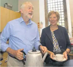  ??  ?? TEA’S UP Jeremy Corbyn helps out at OAP tea party in Fife