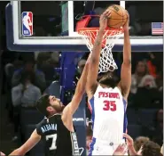  ?? NIKKI BOERTMAN — THE ASSOCIATED PRESS ?? Detroit Pistons forward Marvin Bagley III (35) shoots while defended by Memphis Grizzlies forward Santi Aldama (7) during the first half of Friday’s game in Memphis, Tenn.
