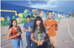  ?? ADOLPHE PIERRE-LOUIS/JOURNAL ?? Lead artist Nani Chacon, front, with student apprentice­s, from left, Jocelin Diaz, Jovani Diaz and Izaiah Ramos stand in front of Washington Middle School’s new mural.