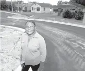  ?? AMY BETH BENNETT/SOUTH FLORIDA SUN SENTINEL ?? Mary Phillips, a real estate broker who lives in an area slated for redevelopm­ent, stands on Martin Luther King Boulevard in Pompano Beach on Nov. 5.