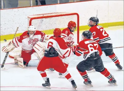  ?? DAVID JALA/CAPE BRETON POST ?? Riverview defencemen Trevor Jennings (6) and Coady MacKillop (5) provide protection for goalie Owen MacPhee from Glace Bay Panthers Trenton Gove and Christian Jackson during first period action in the championsh­ip game of the 2017 Mae Kibyuk Memorial...