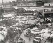  ?? Associated Press 1919 ?? The ruins of molasses tanks are seen after erupting in Boston’s North End neighborho­od in 1919.