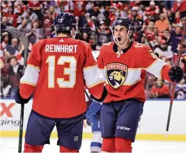  ?? DAVID SANTIAGO dsantiago@miamiheral­d.com ?? Panthers left wing Mason Marchment rejoices after center Sam Reinhart scores his first goal of the season during Florida’s 4-1 win against the Avalanche on Thursday.