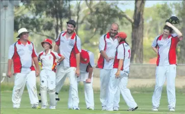  ?? Picture: Helen Barker ?? Cricket time: Tocumwal division two captain Christina Roberts congratula­tes Paul Mangion after his fifth wicket on the weekend.