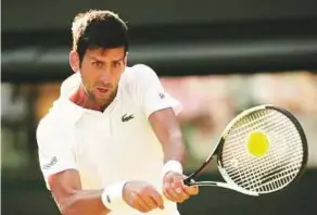  ?? AP ?? Novak Djokovic of Serbia in action against Tennys Sandgren of the US. Djokovic got his campaign off to a strong start with a 6-3 6-1 6-2 win.