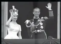  ?? ?? QUEEN Elizabeth II and Prince Philip, Duke of Edinburgh, wave from the balcony at Buckingham Palace, after her coronation at Westminste­r Abbey, London.