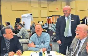  ?? NWA Democrat-Gazette/ Flip Putthoff ?? Michael Poore (right), superinten­dent of Bentonvill­e schools, talks Tuesday with constructi­on profession­als, including Rick Neal, (left) superinten­dent of Pea Ridge schools, during a constructi­on trades “think tank.”