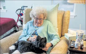  ?? NEW YORK TIMES / AGELESS INNOVATION ?? An elderly woman pats a robotic dog. A study of 271 independen­tly living seniors who suffered from loneliness found ‘there was improvemen­t in their mental well-being, in sense of purpose and optimism,’ after 30 days with a robotic pet.