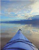  ?? MICHAEL KOHLER/PROVIDED ?? A kayak glides over an ephemeral lake at Death Valley National Park. Dubbed “Lake Manly,” the lake was closed to boating last month by the park service.