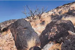  ?? DEAN HANSON/JOURNAL ?? One of the many rock carvings at appear at Petroglyph National Monument. “We’re surrounded by a very active, fast-growing, city,” said Dennis Vasquez, the monument’s superinten­dent.