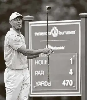  ?? Jamie Squire / Getty Images ?? Tiger Woods tees off from No. 1 during the first round of The Memorial on Thursday at Muirfield Village. Woods is five shots back of leader Tony Finau.