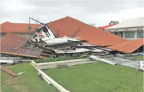  ?? Photo: ABC ?? Tonga’s Parliament House was flattened by Cyclone Gita.