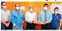  ?? ?? K. M. M. Jabir, Director and Chief Executive Office of Orient Finance PLC handing over the equipment to Prof. Premawardh­ena Internal Medicine Specialist attached to the University Medical Unit of Colombo North Teaching Hospital – Ragama and Dr. Sampth Ranaweera Liyanage, Director of the Colombo North Teaching Hospital – Ragama