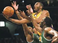  ?? Branimir Kvartuc / Associated Press ?? In this Feb. 23, 2007, file photo, Los Angeles Lakers’ Kobe Bryant, top, goes up for a shot between Boston Celtics’ Paul Pierce, left, and Al Jefferson during the first half in Los Angeles.