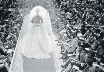  ?? Robert Walker, © The New York Times Co. ?? A Gimbels’ department store fashion show of bridal attire in New York in 1965.