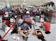  ??  ?? DELAYS Travellers grounded at Ataturk airport