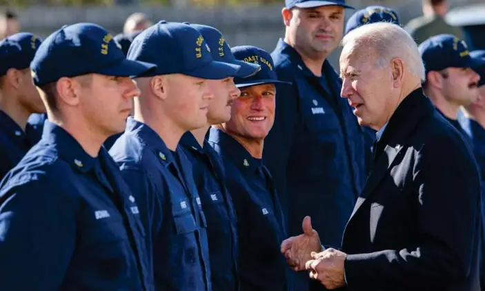  ?? Photograph: Mandel Ngan/AFP/Getty Images ?? Joe Biden greets members of the Coast Guard at US Coast Guard Station Brant Point in Nantucket, Massachuse­tts on Thursday.