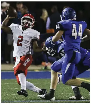  ?? Arkansas Democrat-Gazette/MITCHELL PE MASILUN ?? Fort Smith Northside’s Derrick Wise (2) tries to throw as he’s pursued by Conway linebacker­s Reed Hughes (44) and Parker Prock (45) on Friday at John McConnell Stadium in Conway. Conway won 35-21. More photos from this game are available at arkansason­line.com/galleries.