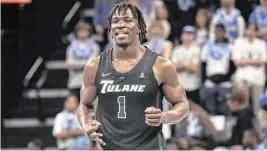  ?? PETRE THOMAS USA TODAY Sports ?? Tulane’s Sion James (1) reacts after making a 3-point basket during a game against the Memphis Tigers at FedExForum in February 2024.