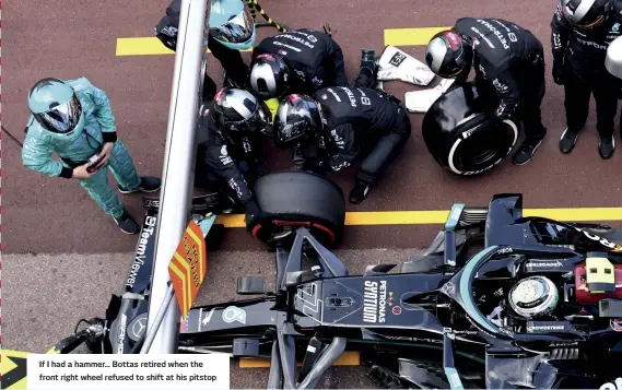  ??  ?? If I had a hammer... Bottas retired when the front right wheel refused to shift at his pitstop