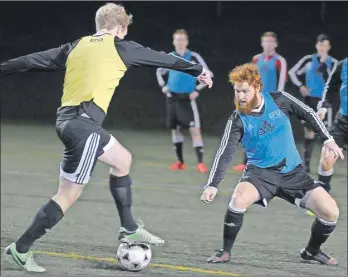  ?? GUARDIAN PHOTO BY JASON MALLOY ?? Dillon Wight, right, defends during UPEI Panthers soccer practice Wednesday night. The team is in St. John’s, N.L., for the Atlantic University Sport men’s soccer championsh­ips.