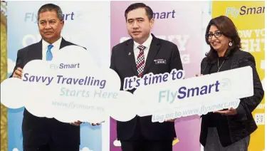  ??  ?? Launch signs: (From left) Transport Ministry secretary-general Datuk Seri Saripuddin Kasim, Loke and Mavcom’s director of consumer affairs S. Pushpalath­a posing for a photo at the FlySmart platform launch at KLIA.