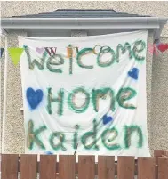  ??  ?? ● A Welcome Home banner at Y Glyn, Caernarfon, to mark the homecoming