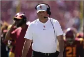  ?? ASHLEY LANDIS — THE ASSOCIATED PRESS ?? USC head coach Clay Helton walks on the sideline during a game against San Jose State last Saturday in Los Angeles.