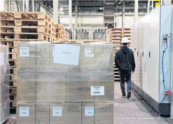  ?? NYT ?? REC Silicon prepares to fulfill its first shipment of polysilico­n granules, which are used in the production of solar panels, at its factory in Moses Lake, Washington, on April 24.