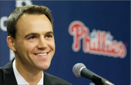  ?? THE ASSOCIATED PRESS FILE ?? Smiling through the pain, Phillies general manager Matt Klentak is dipping into the farm system for help club. But the recent call ups don’t include the prospects most Phils fans are clamoring to see. for his lastplace