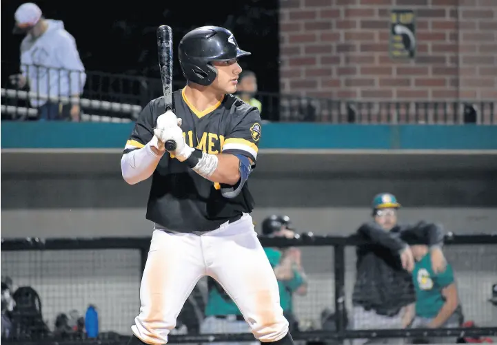  ?? PHOTO PROVIDED BY THE OILMEN ?? Casey Kmet, a St. Viator graduate and an infielder for the Northwest Indiana Oilmen, bats against the Joliet Generals on Thursday.