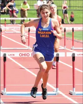  ?? Staff photo/Jason Alig ?? Marion Local’s Sam Hoelscher competes in the girls’ 300 meter hurdles prelims on Friday. Hoelscher took second in the finals with a time of 43.72.