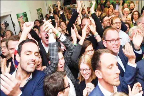  ??  ?? Members of Greens jubilating after their share of the vote rise substantia­lly to 19.5% in Germany...yesterday