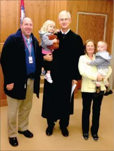  ?? COURTESY PHOTO ?? Jim Lewis, retired Lincoln School District superinten­dent, left, served as a court appointed advocate for these two children, Michelle and Mikie. They are pictured above with Judge Mark Fryauf following the adoption of the children by their...