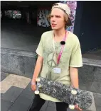  ?? (Matthew Stock/Reuters) ?? JASON KNIGHT holds one of his skateboard decks made from shredded plastic bags in London last month.