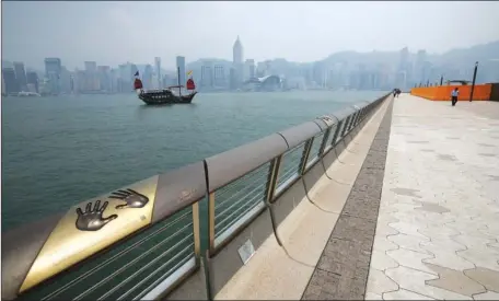  ?? CALVIN NG / CHINA DAILY ?? Few visitors can be seen on Friday at the Avenue of stars in Tsim Sha Tsui, which used to be a favorite spot for tourists to enjoy the splendor of Victoria Harbour and the Hong Kong skyline.