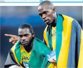  ?? AFP ?? Carter y Bolt corrieron en el equipo jamaiquino de relevos en las Olimpiadas de Pekín 2008..